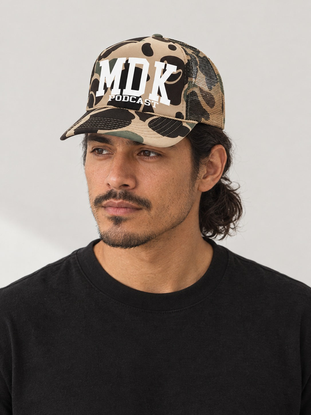 MDK BROWN CAMO TRUCKER HAT on model
