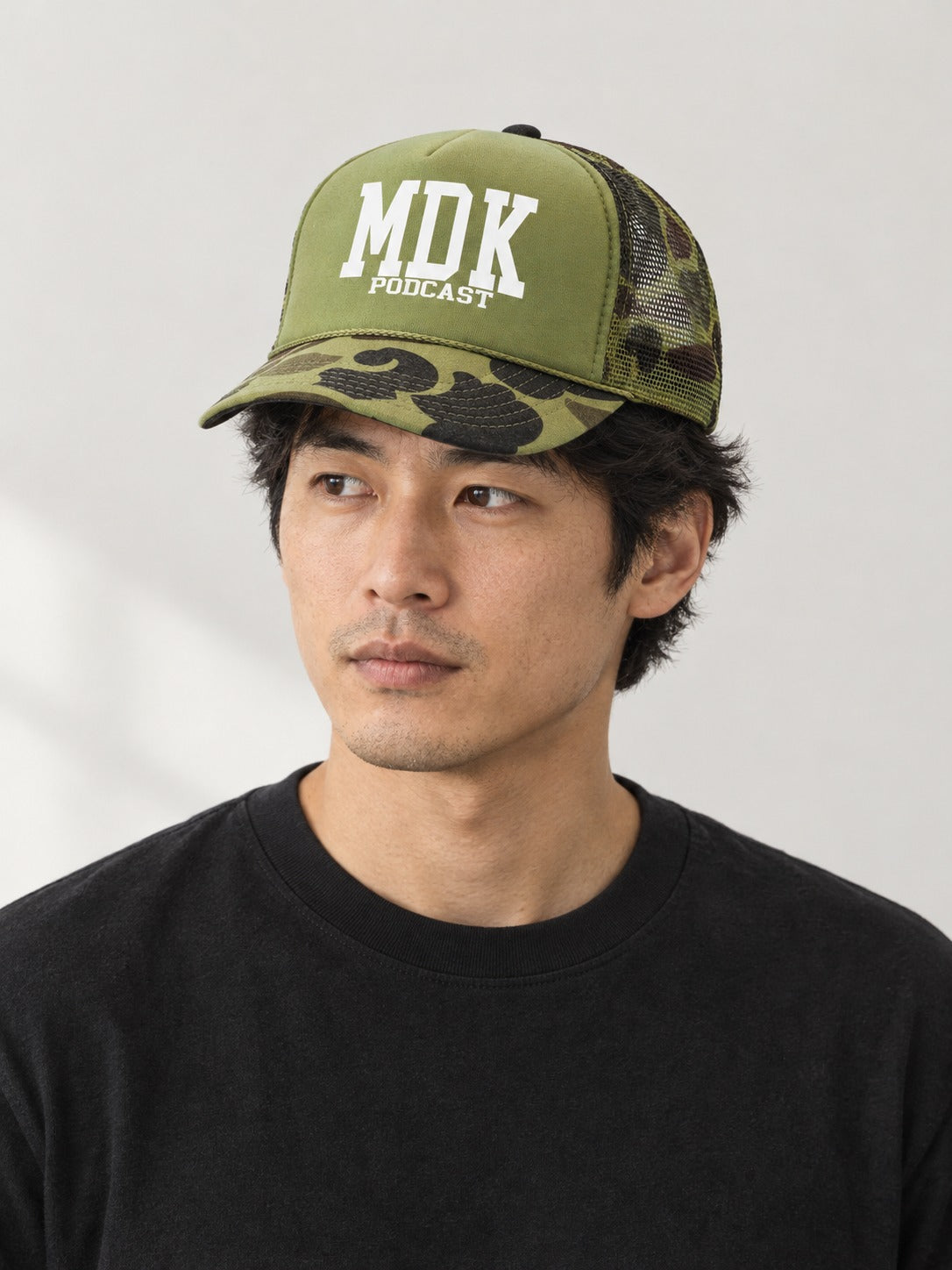 MDK CAMO GREEN PANEL TRUCKER HAT on model