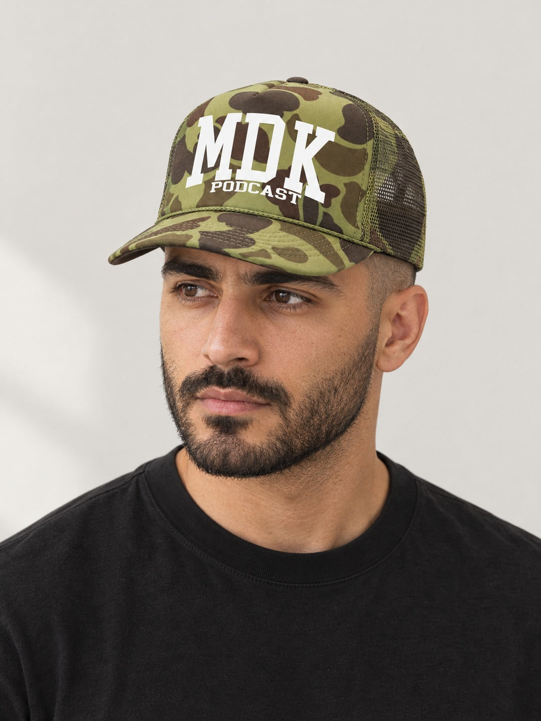 MDK FULL CAMO TRUCKER HAT on model